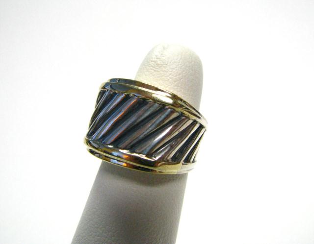 Appraisal: David Yurman two-tone Carved Cable ring size some wear and