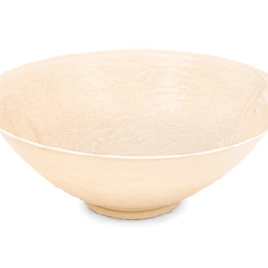 Appraisal: A Japanese White Glazed Molded Bowl the sloping walls resting