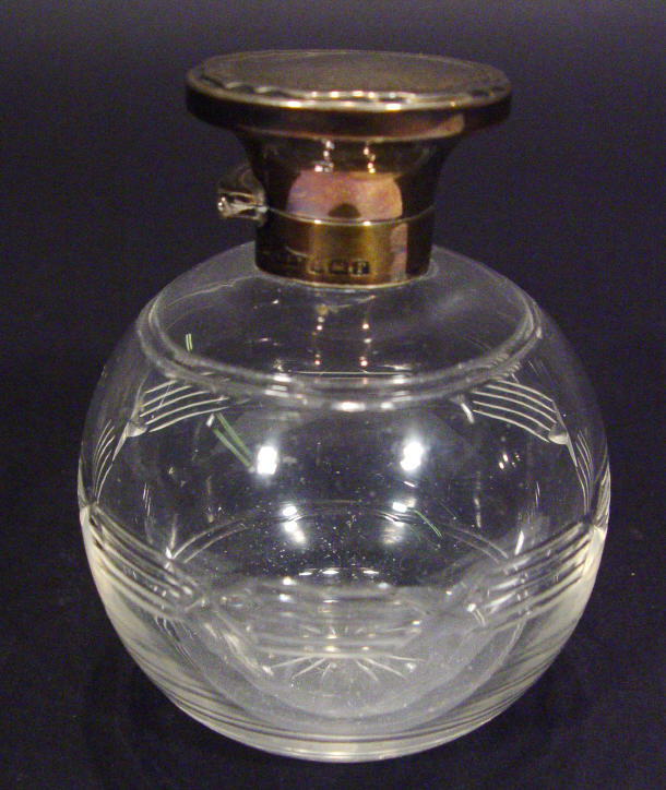 Appraisal: Globular cut glass scent bottle and stopper with silver top