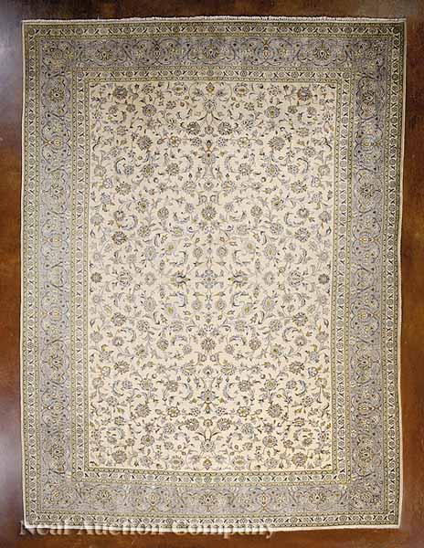 Appraisal: A Persian Kashan Carpet cream ground with blues and yellows