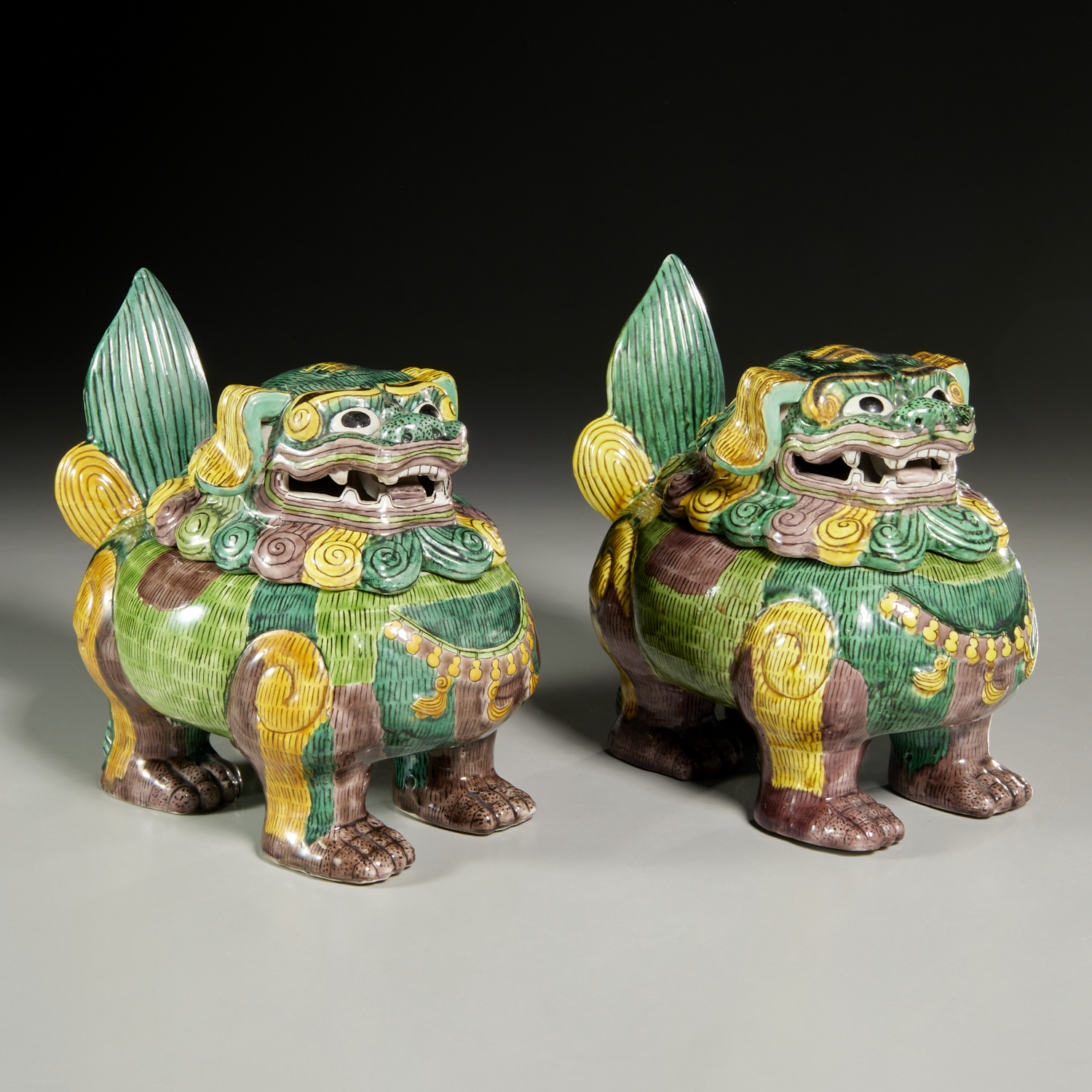 Appraisal: PAIR CHINESE SANCAI BUDDHIST LION CENSERS th th c polychrome