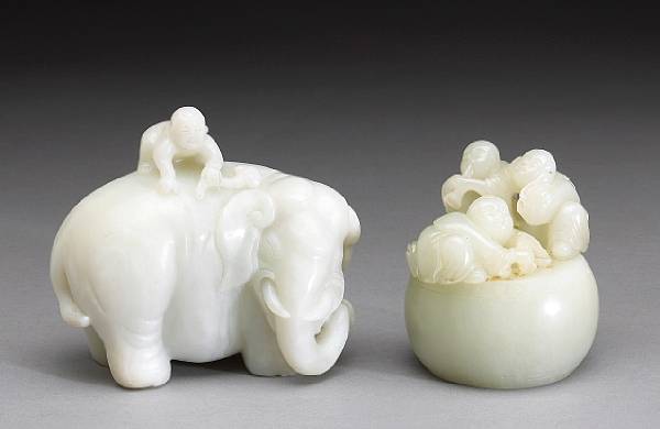 Appraisal: Two jade carvings of children The first depicting a baby