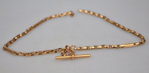 Appraisal: A ct gold watch chain with T-bar and long Belcher