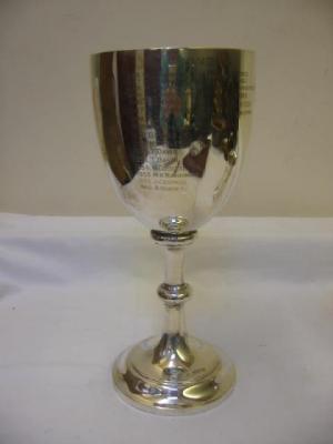 Appraisal: A TROPHY of goblet form with inscribed ovoid top knopped