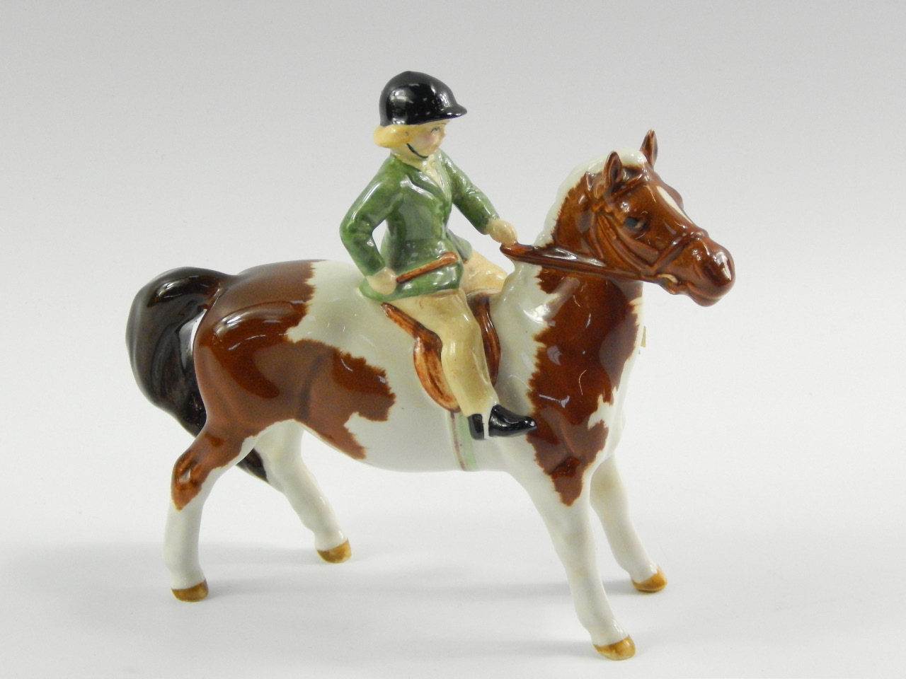 Appraisal: A Beswick figure of a girl on a Skewbald pony