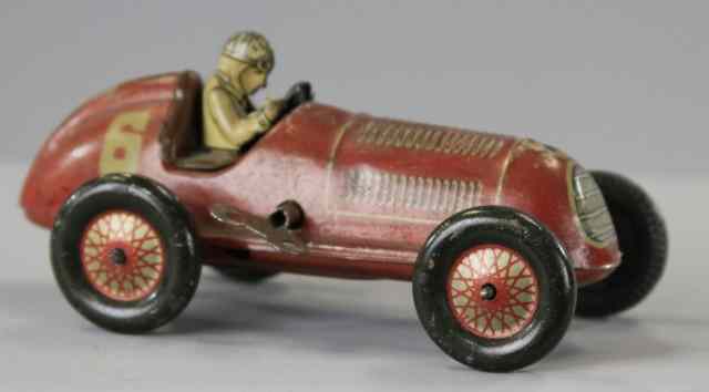 Appraisal: TIN KEY WIND RACER Lithographed tin open racer with seated