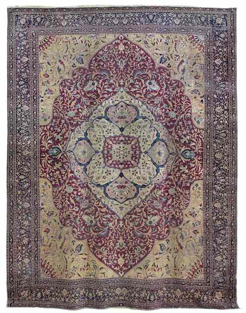 Appraisal: Kirman carpet ca with a central ivory medallion and floral