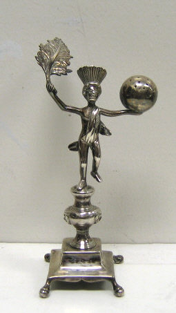 Appraisal: SILVER FIGURAL HAT PIN HOLDER In form of a part-clad