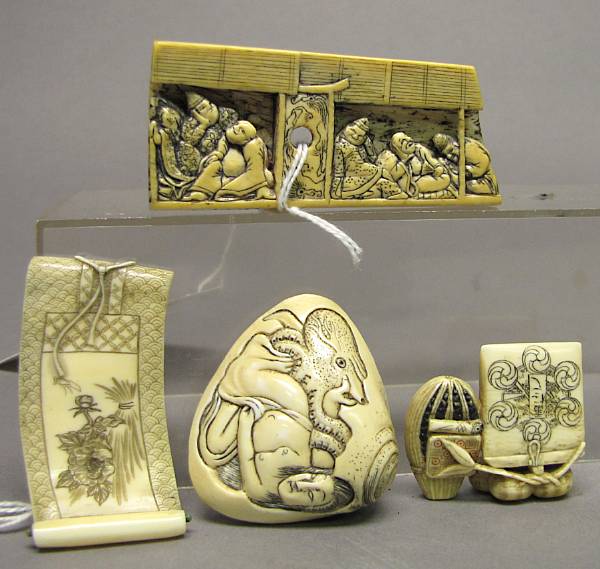 Appraisal: A group of four carved ivory netsuke The first a