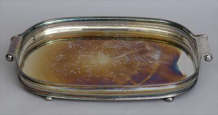 Appraisal: ENGLISH SILVER-PLATED GALLERIED TRAY The oval surface within pierced surround