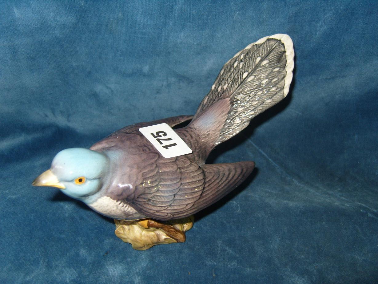 Appraisal: A Beswick model of a cuckoo with impressed number to