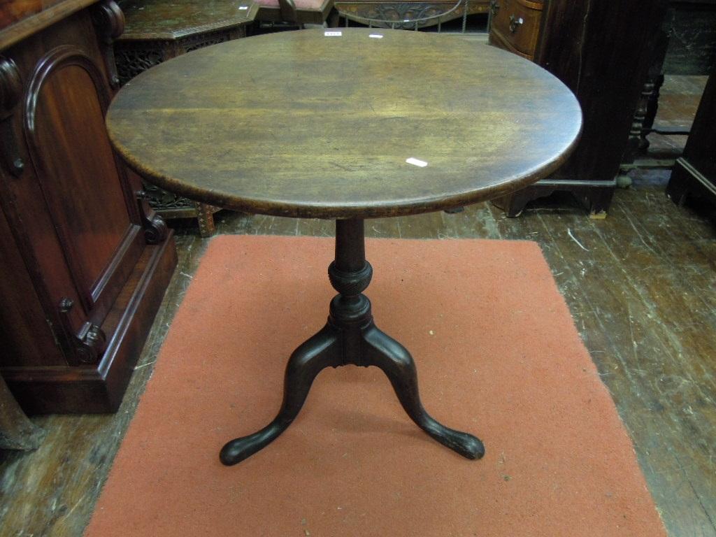 Appraisal: A Georgian mahogany tilt top occasional table of circular form