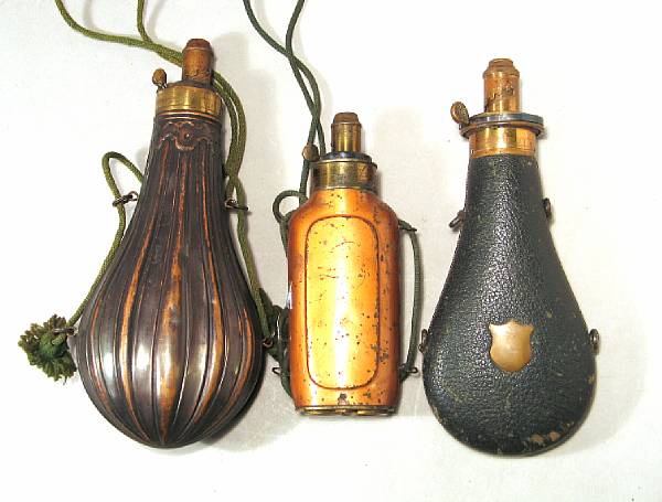 Appraisal: A lot of three th century powder flasks Comprising Three