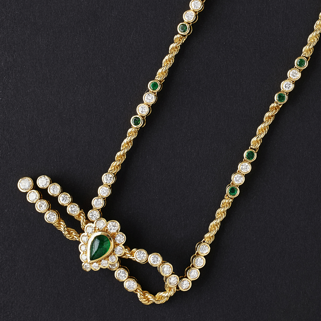 Appraisal: An emerald and diamond set necklace collet set with a