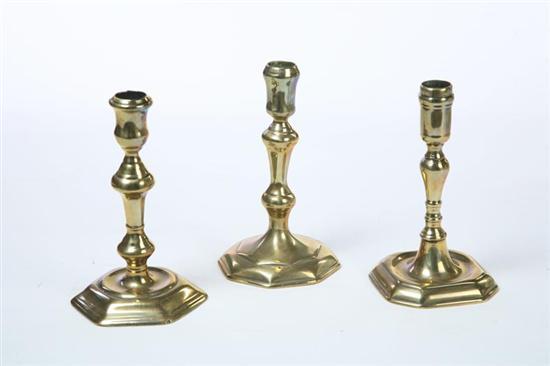 Appraisal: THREE BRASS CANDLESTICKS English mid th century Seamed construction Hexagonal