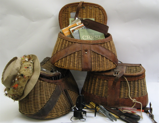 Appraisal: THREE WICKER AND LEATHER FISHING CREELS with contents Creel Magazines