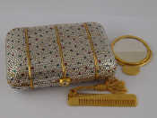 Appraisal: A Judith Leiber hard case clutch bag covered in reflective