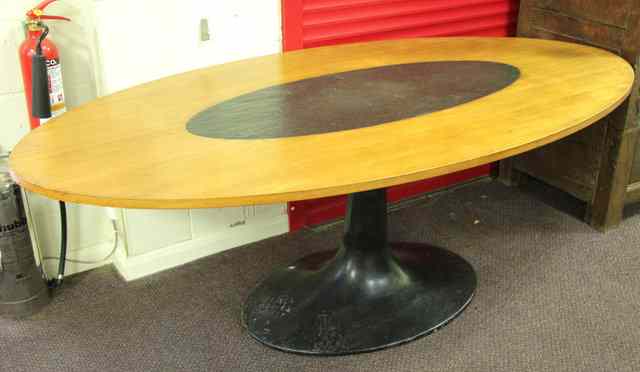 Appraisal: An oval dining table in the manner of Eero Saarinen