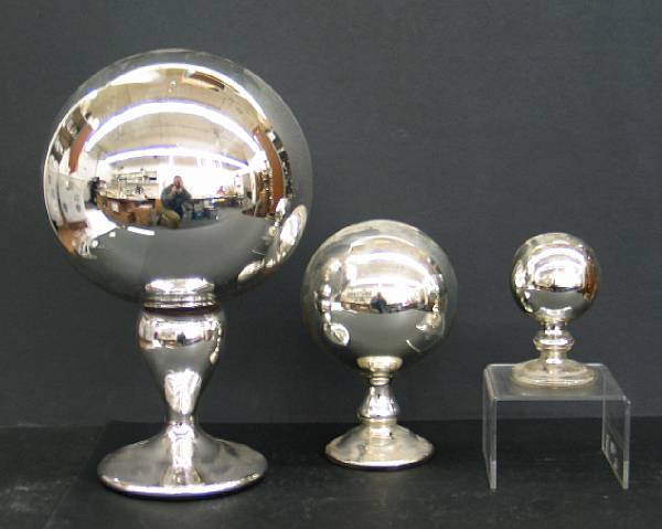 Appraisal: Five silvered mercury glass gazing globes on stands second half