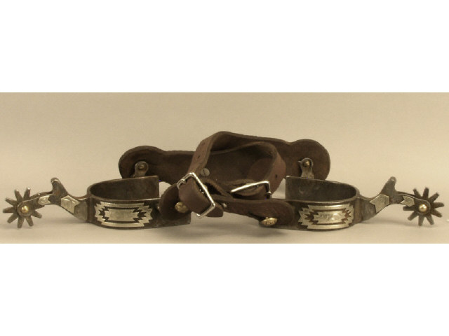 Appraisal: One pair of contemporary single mount overlaid spurs with leather