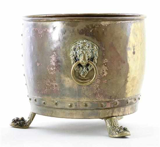 Appraisal: Continental brass footed jardiniere late th century bulbous form flanked