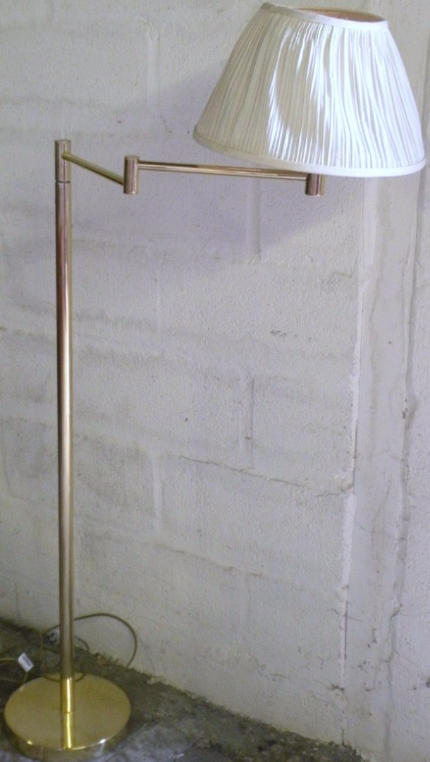 Appraisal: A thC brass lamp with cylindrical articulated arm and plain