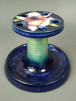 Appraisal: A Moorcroft 'Orchids' pottery pipe stand circa the body finished