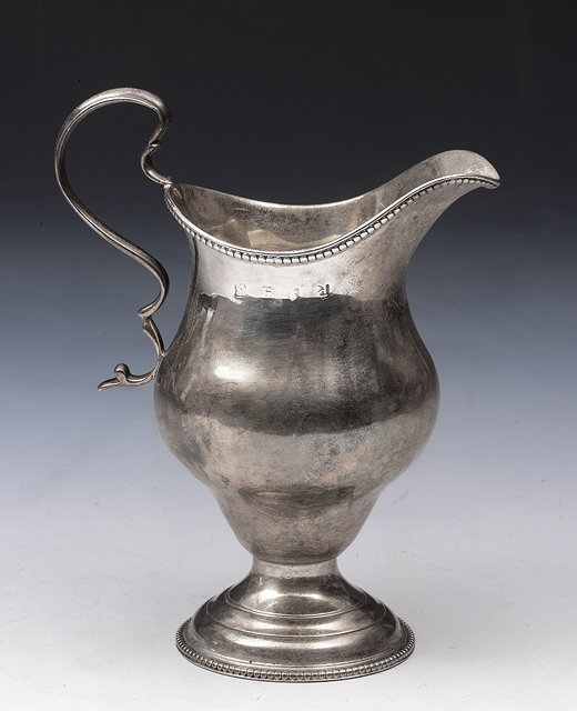 Appraisal: A GEORGE III SILVER HELMET JUG with beaded edge matching