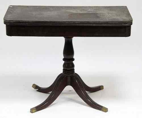 Appraisal: A Regency mahogany fold-over card table the baize lined top