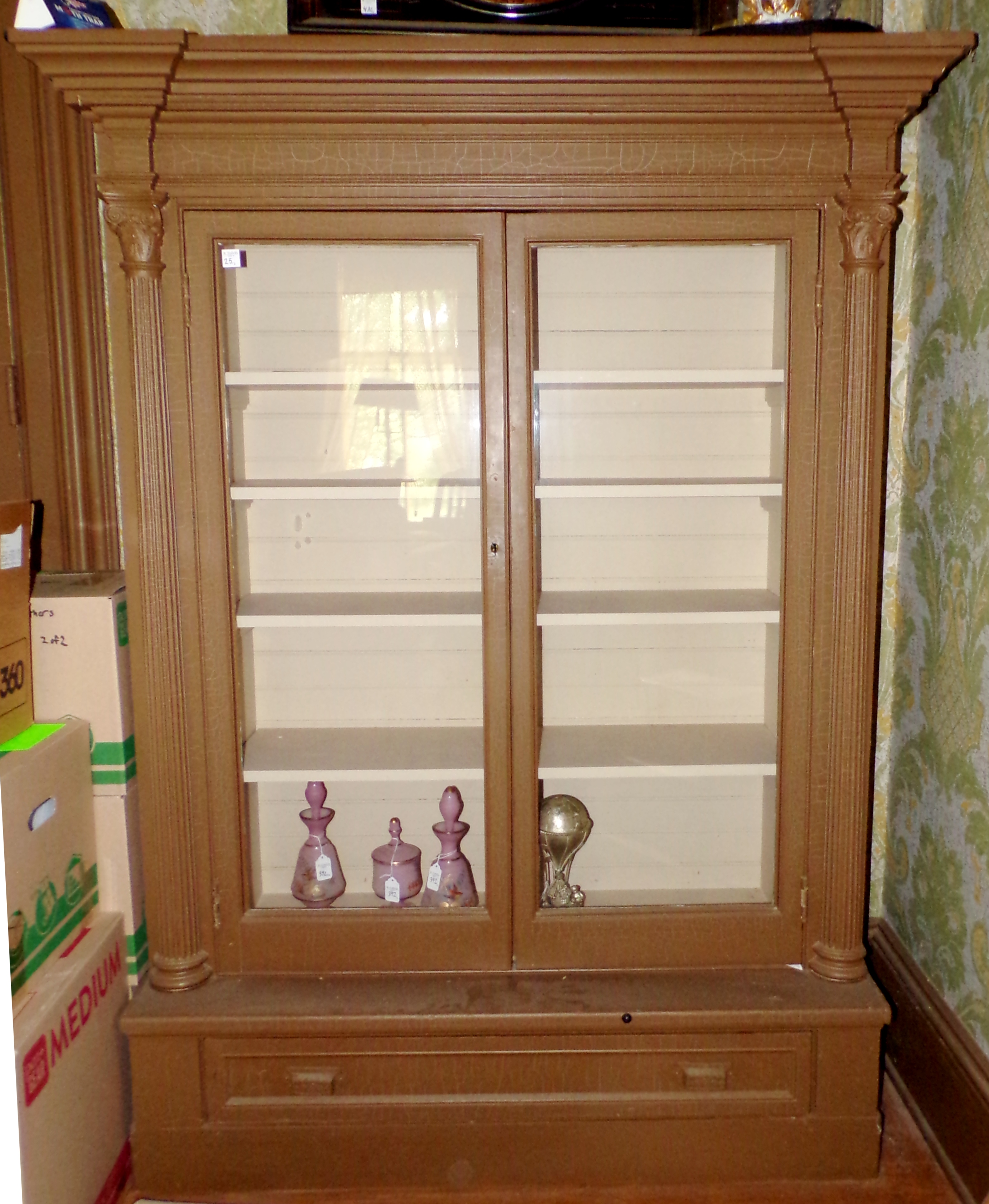 Appraisal: Pair of Bookcases painted doors over drawer shelves carved column