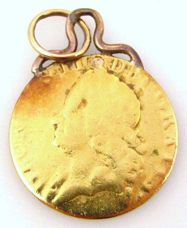 Appraisal: A George III gold spade guinea on soldered mount date