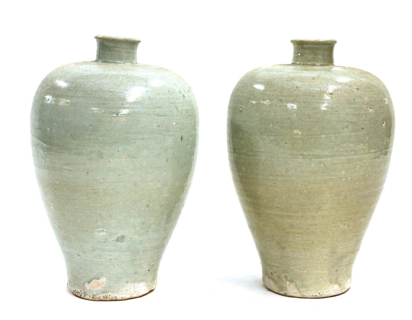 Appraisal: A pair of Chinese celadon glazed pottery vases of ovoid