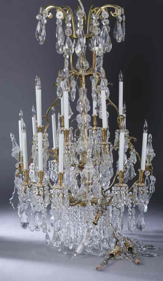 Appraisal: CONTINENTIAL STYLE CRYSTAL -LIGHT TWO-TIER CHANDELIER In ''as-is'' condition First