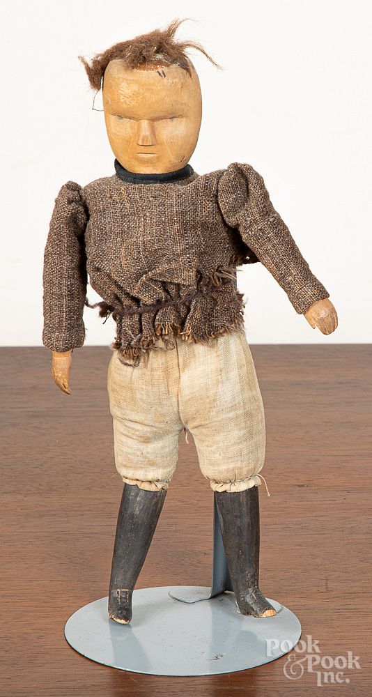 Appraisal: Early carved wood boy doll h Early carved wood boy