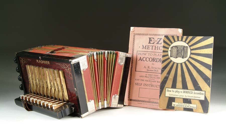 Appraisal: HOHNER ACCORDION Circa accordion with instruction booklets SIZE w x