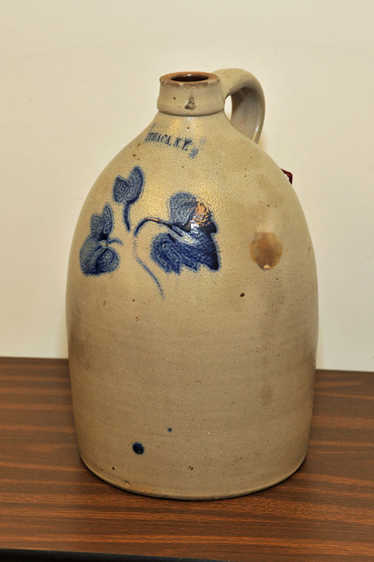 Appraisal: STONEWARE JUG Stamped ''Ithaca N Y '' With cobalt floral