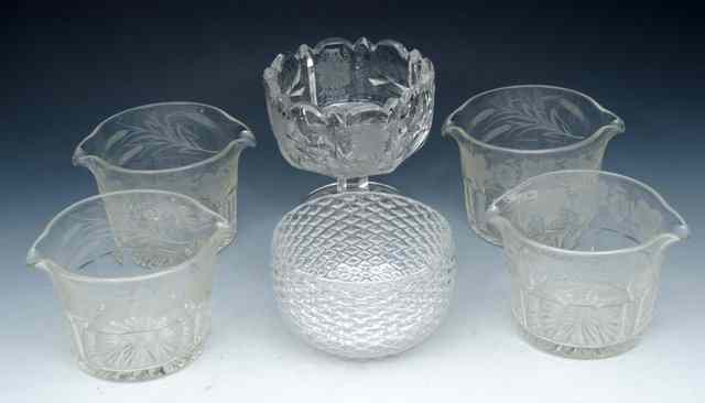 Appraisal: A SET OF FOUR PANEL-CUT RINSERS engraved with fruiting vine