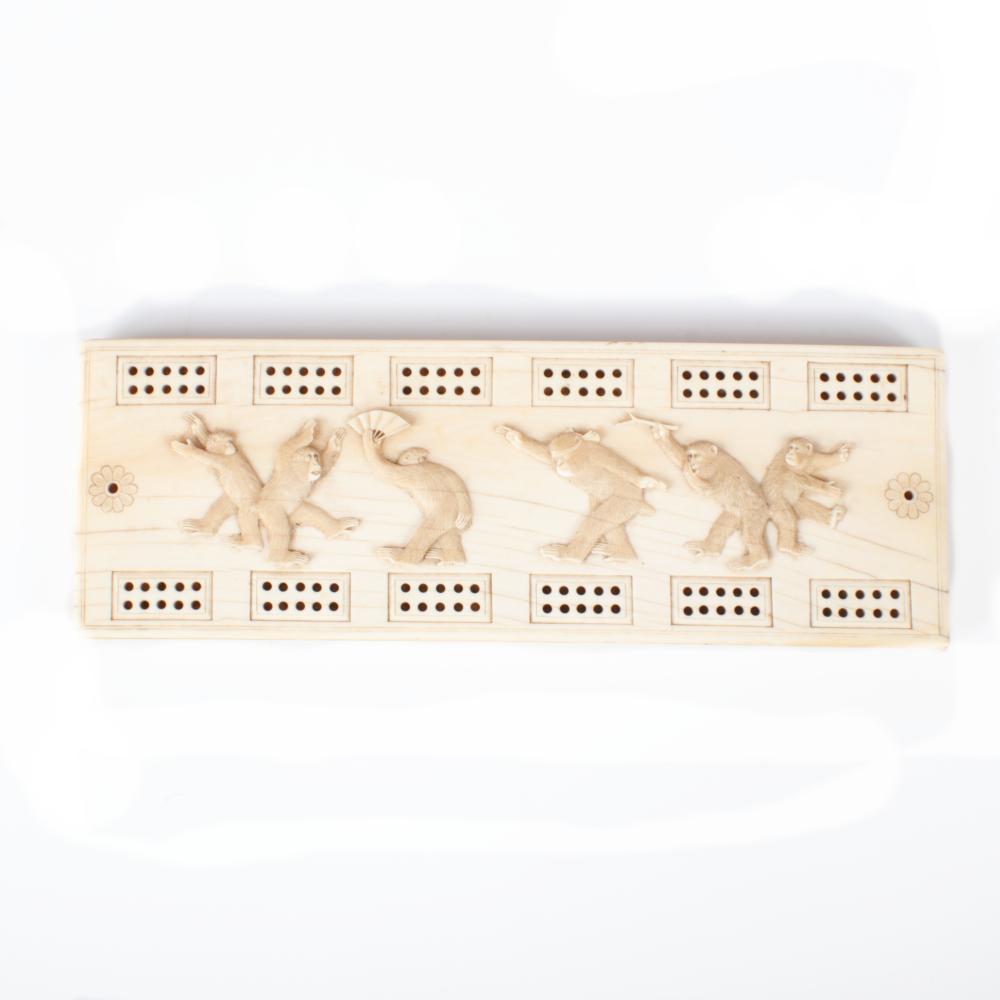 Appraisal: JAPANESE ASIAN CARVED CRIBBAGE GAME BOARD WITH MISCHIEVOUS PLAYFUL MONKEYS