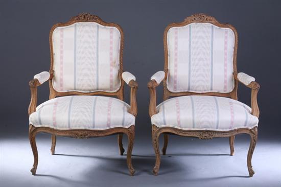 Appraisal: PAIR REGENCE STYLE CARVED OAK FAUTEUILS th century With pink