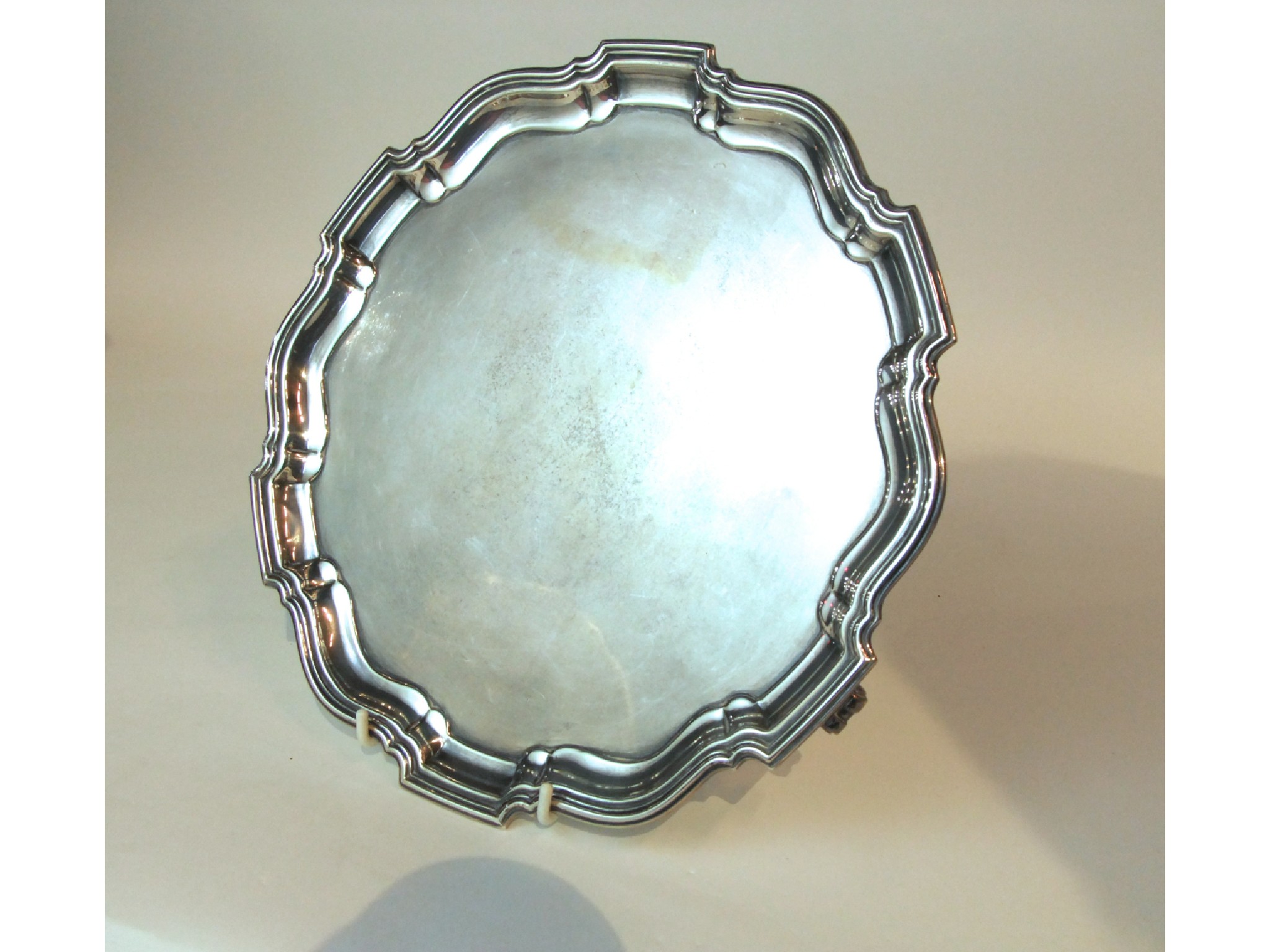 Appraisal: A silver salver Barker Brothers Silver Ltd Birmingham of circular