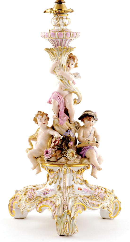 Appraisal: Meissen porcelain candlestick th century group of putti supporting cornucopia