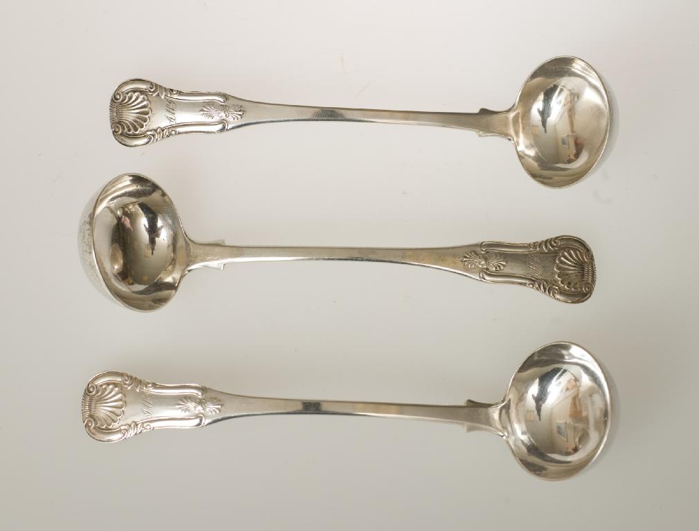 Appraisal: SET OF THREE WILLIAM IV SCOTTISH SILVER SAUCE LADLES KINGS