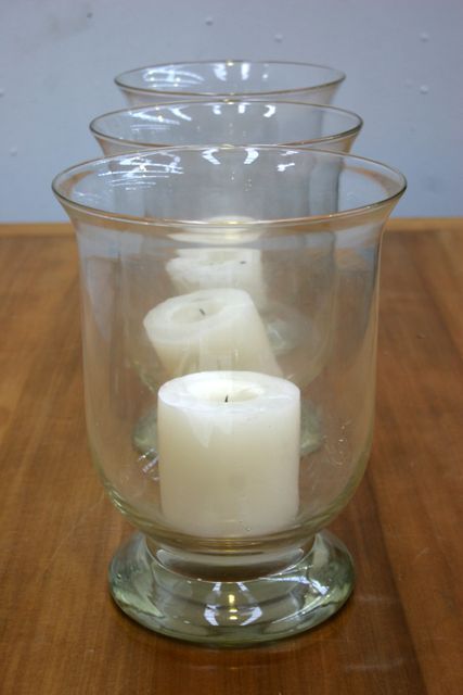 Appraisal: Three contemporary glass candle holders