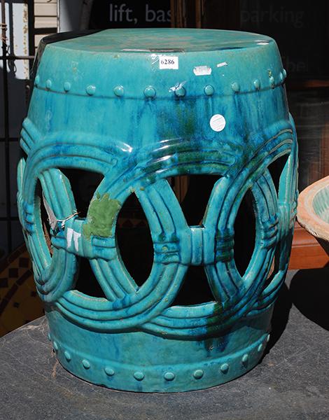 Appraisal: A CHINESE PIERCED GREEN GLAZED EARTHENWARE BARRELL STOOL cm high