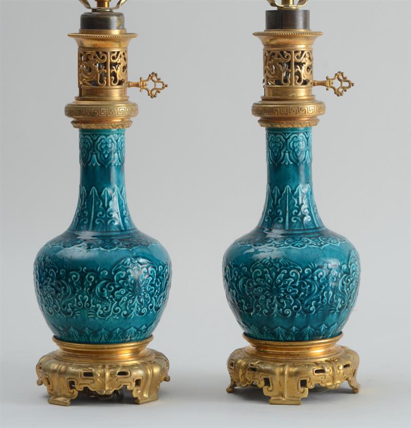 Appraisal: PAIR OF FRENCH CHINOISERIE GILT-METAL MOUNTED TURQUOISE-GLAZED POTTERY OIL LAMPS