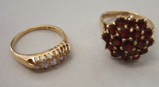 Appraisal: A ct gold and garnet set hexagonal cluster ring and