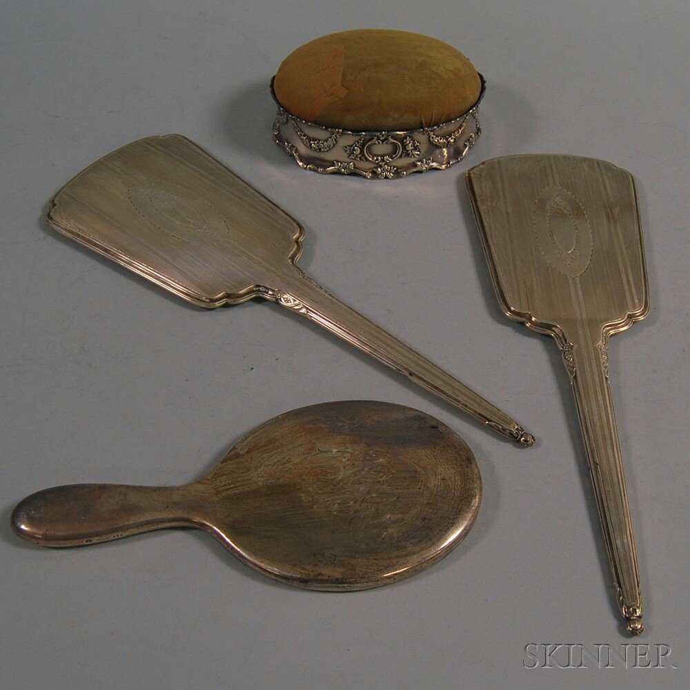 Appraisal: Three Sterling Silver-mounted Hand Mirrors and a Hatpin Cushion a