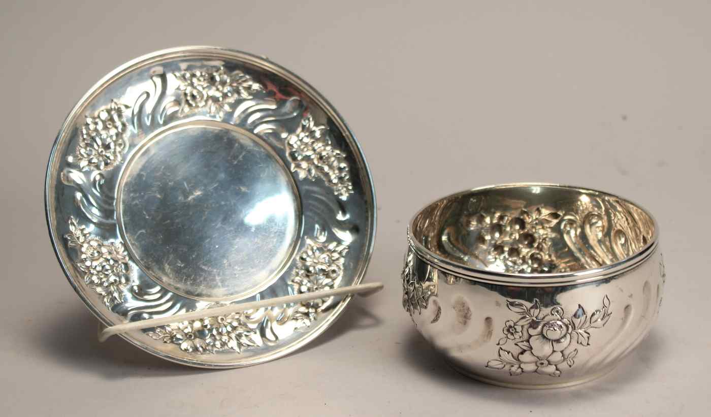 Appraisal: TIFFANY STERLING SILVER BOWL AND UNDERTRAYIn a repousse floral design