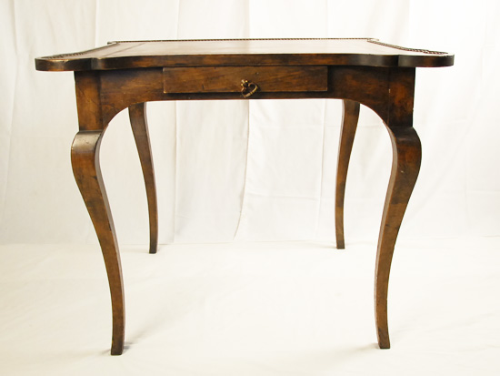 Appraisal: A French Leather Top Game Table the leather with brass