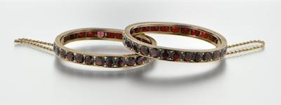 Appraisal: A Pair of Victorian Garnet Bangle Bracelets Gilt silver hinged